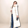 Long women's quilted winter jacket below the knees with a fur-trimmed hood