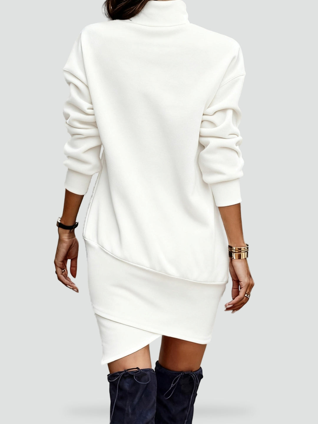 Knitted mini dress with a turtleneck and an asymmetrical hemline