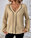 Elegante damesblouse voor op kantoor met lange mouwen en bies