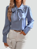 Elegant women's blouse with neck tie and long sleeves