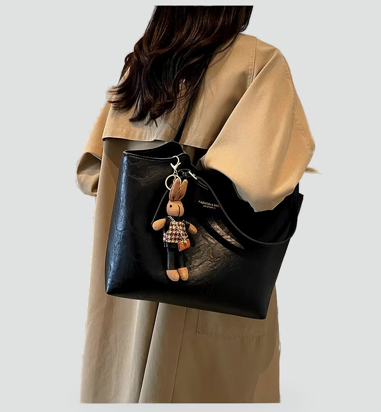 Dameshandtas met afneembare hanger en leren randafwerking