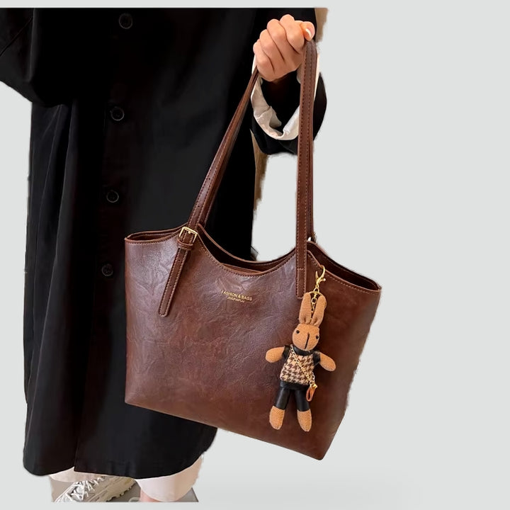 Dameshandtas met afneembare hanger en leren randafwerking