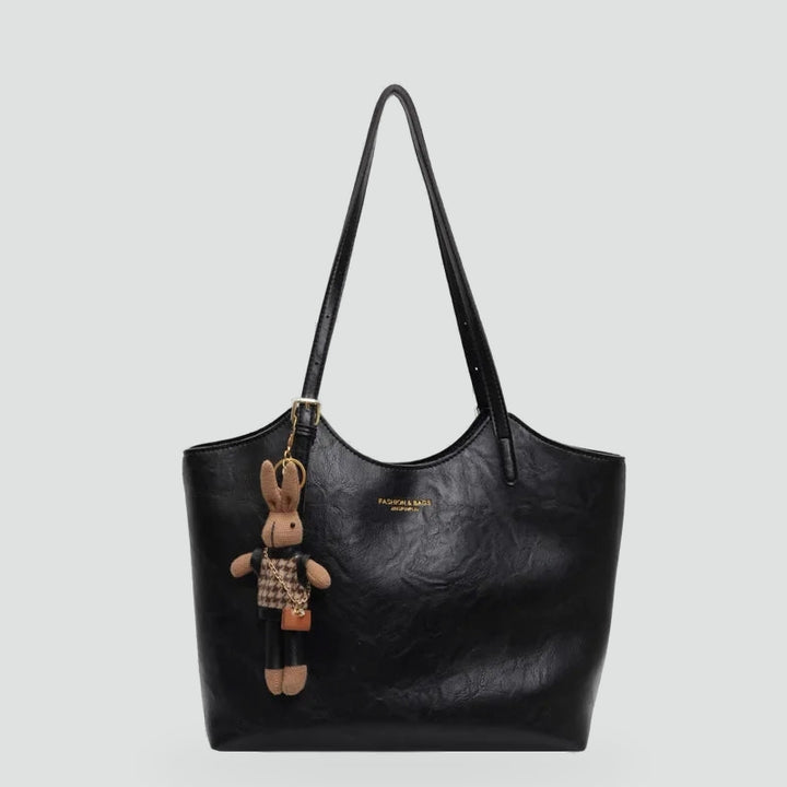 Dameshandtas met afneembare hanger en leren randafwerking
