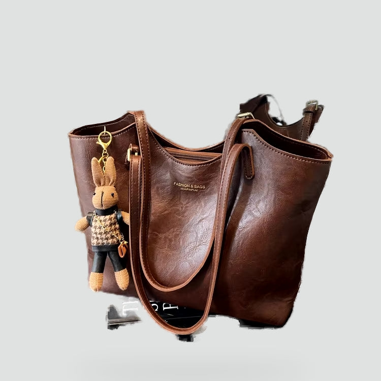 Dameshandtas met afneembare hanger en leren randafwerking
