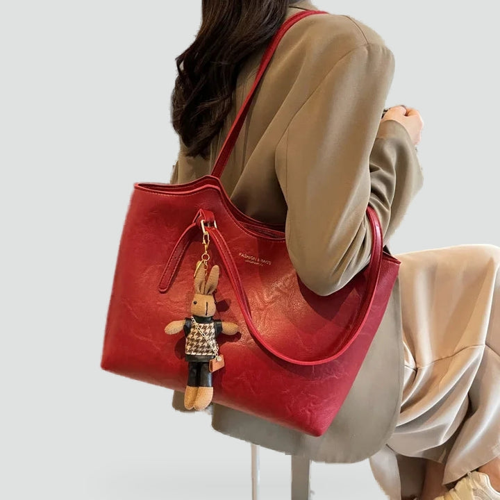 Dameshandtas met afneembare hanger en leren randafwerking
