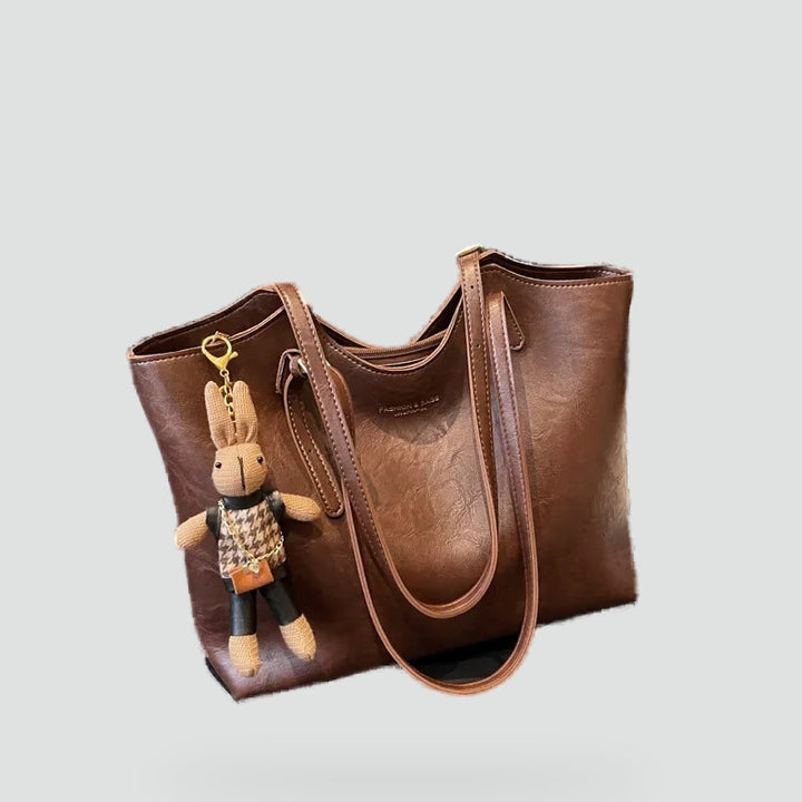 Dameshandtas met afneembare hanger en leren randafwerking