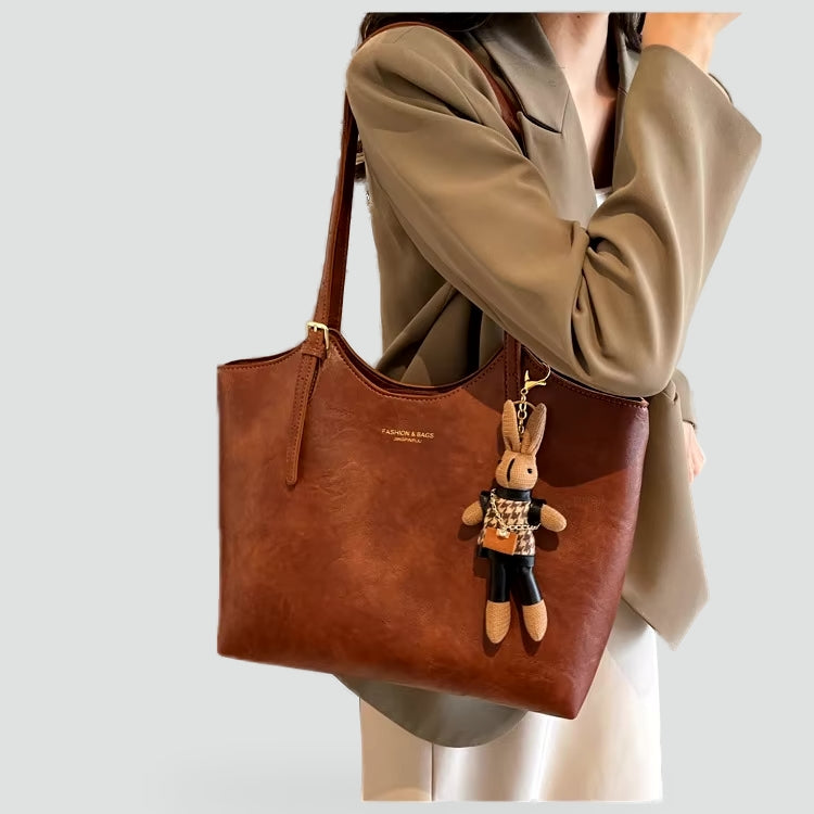 Dameshandtas met afneembare hanger en leren randafwerking
